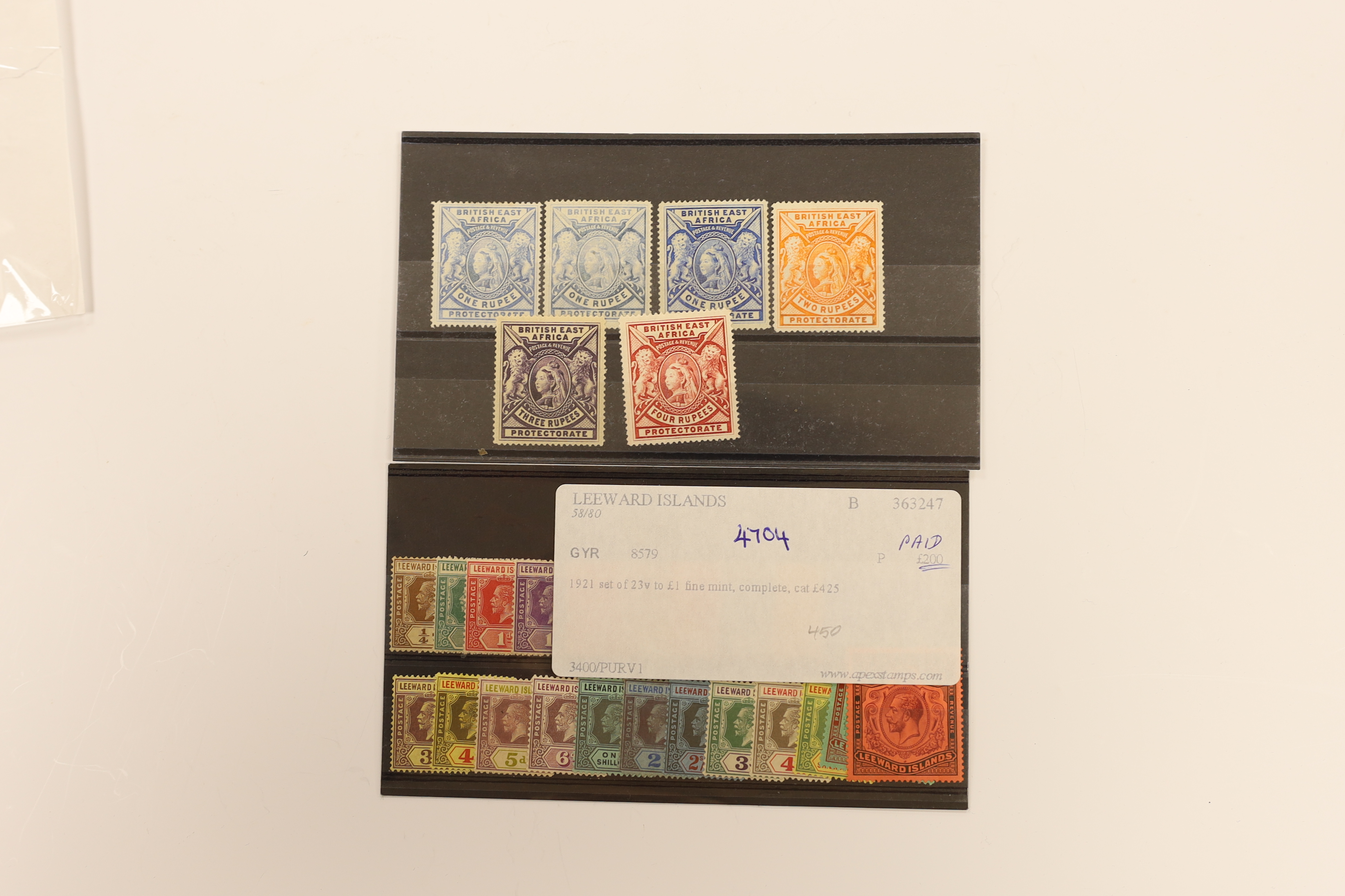 A selection of stamps including British East Africa, 1897 1r to 4r, Leeward Islands 1890 set, 1921 set to £1, K.U.T. 1912 1c to 10r, Tangyika 1927 to £1, Uganda 1898 set, Mauritius 1879-80 set, 1921 to 10r (2) etc.